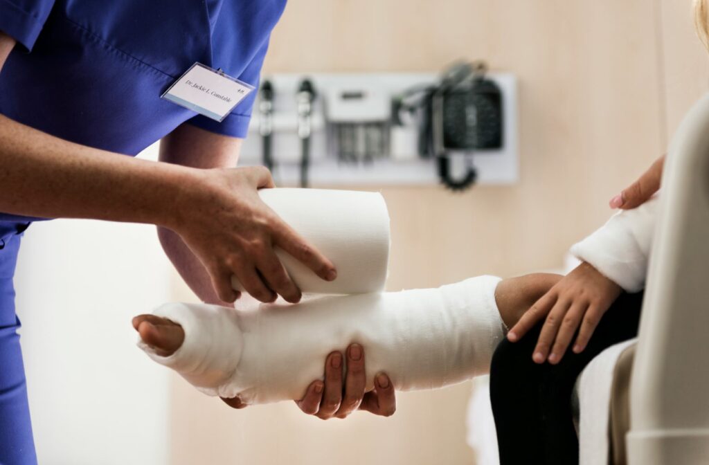 childrens broken leg after san antonio accident doctor purple scrubs cast